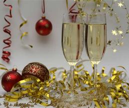 two champagne glasses among decorations