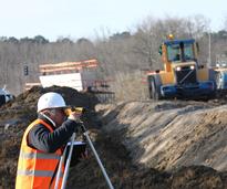 engineer surveying on job site