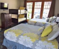 lake george beach cottages bedroom with two beds and bunk beds