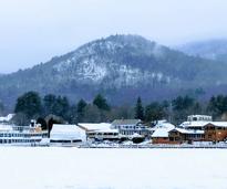 Lake George with lake, houses, mountain in winter