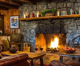 large stone fireplace in rustic lounge