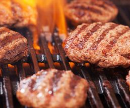 meat patties on a grill 
