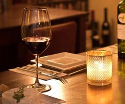 a dimly lit restaurant, place setting