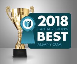 golden cup with region's best badge