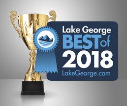 golden cup with best of lake george badge