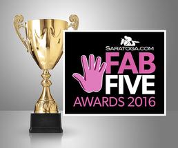 golden cup with fab five badge