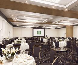 banquet space with round tables and chairs