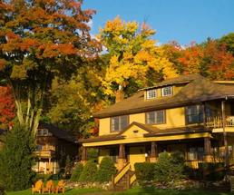 cabin surrounded by fall foliage