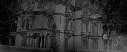 black and white photo of spooky large house