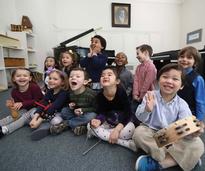 a group of little kids with instruments
