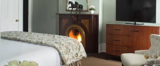 fireplace at the end of a bed