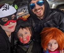 family of four in halloween costumes