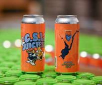 orange beer cans from artisanal brew works