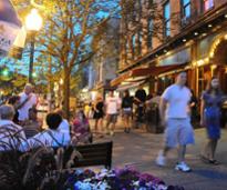 people on broadway in saratoga at dusk