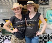 two women in shirts that say giving back is always in style