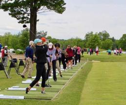 line of women golfing