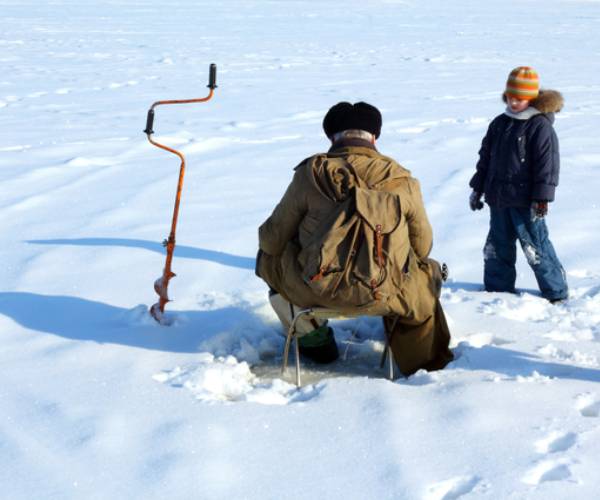 man and kid ice fishing