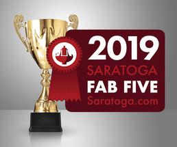 fountain in saratoga with fab five badge
