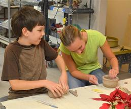 two kids making things out of clay