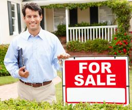 realtor with for sale sign