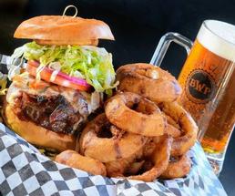 huge burger, onion rings, beer mug