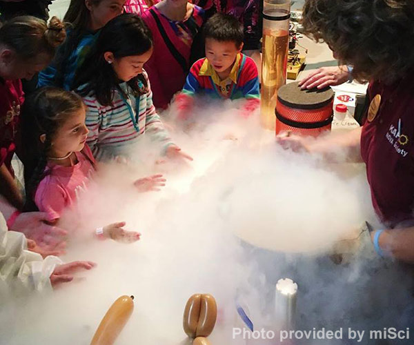 kids watching a science experiment