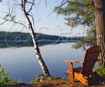 Adirondack chair by lake