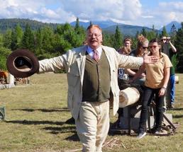 Teddy Roosevelt with his arms out