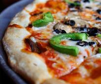 pizza with cheese, olives, and green peppers