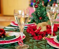 holiday plates, glasses, and decor on a table
