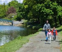 family walks in washington park in spring