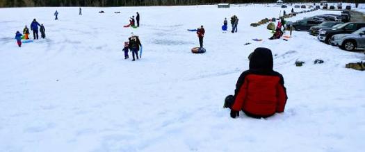 people at a tubing hill