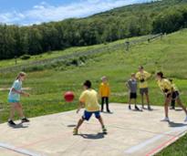 summer camp kids at west mountain play four square