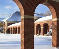 snow covered building in saratoga spa state park, view looking through arches