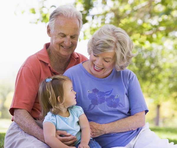 grandparents with their grandaughter