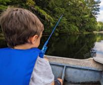 kid fishing in lake