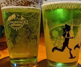 two glasses of green beer