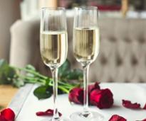 two glasses of champagne with roses