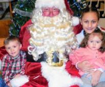 santa poses with kids