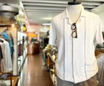 glasses with shirt on mannequin in men's clothing store
