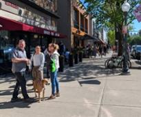 people on sidewalk in downtown saratoga springs