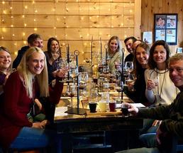 group of people with flights of wine and beer
