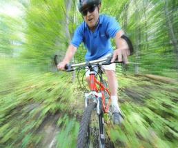 mountain biker in woods