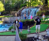 people at a mini golf course