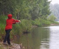 person in red coat fishing