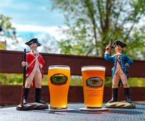 two pints of beer with two revolutionary war figurines