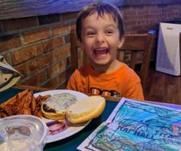 happy kid at a restaurant