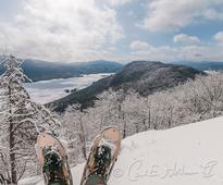 snowshoes with lake george in the background
