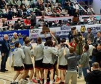 basketball team cheers after winning state championships
