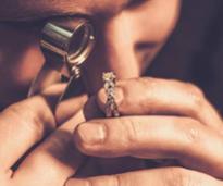 jeweler examining an engagement ring